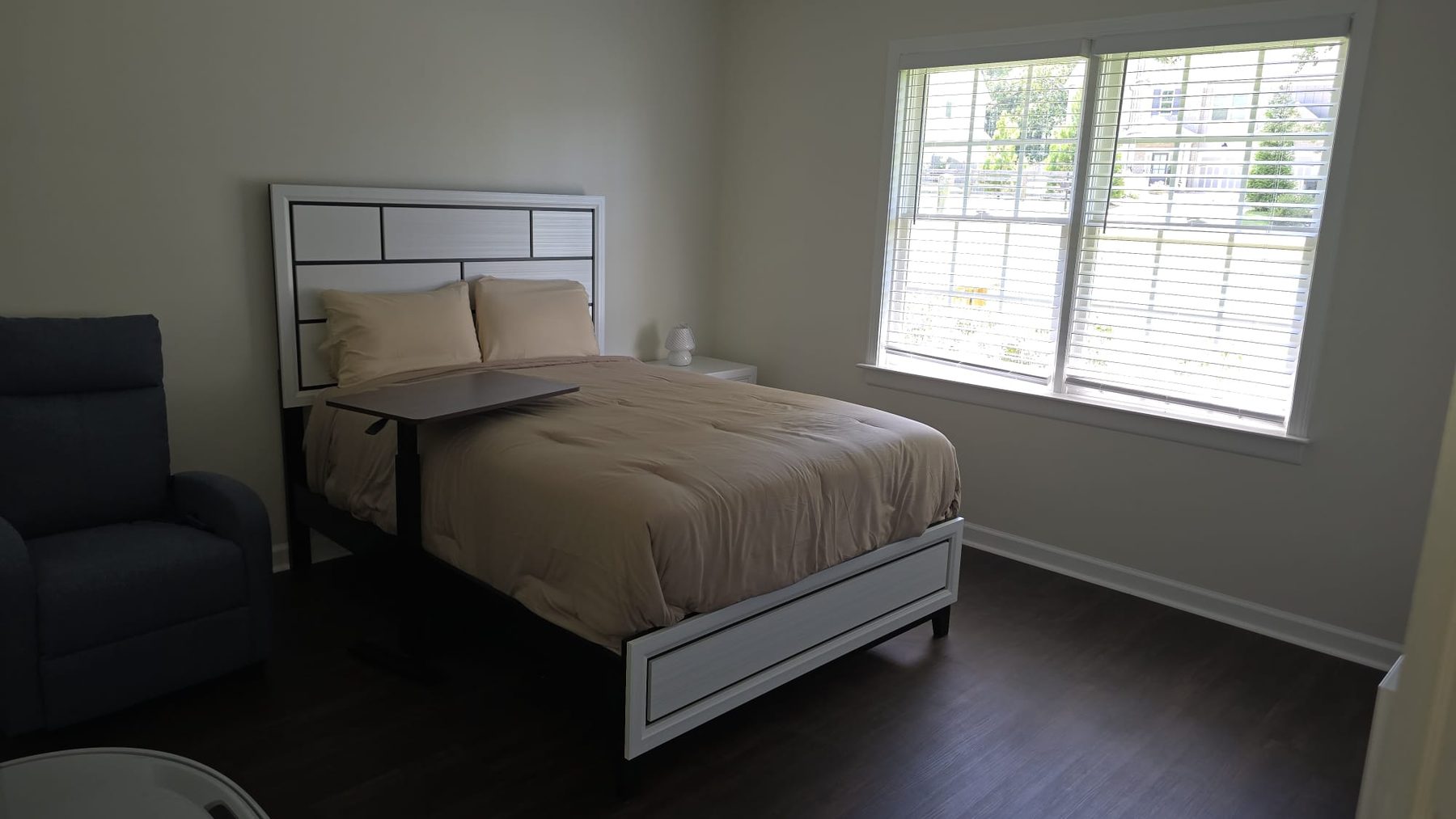 Bright resident bedroom at Blossom Hill Senior Living